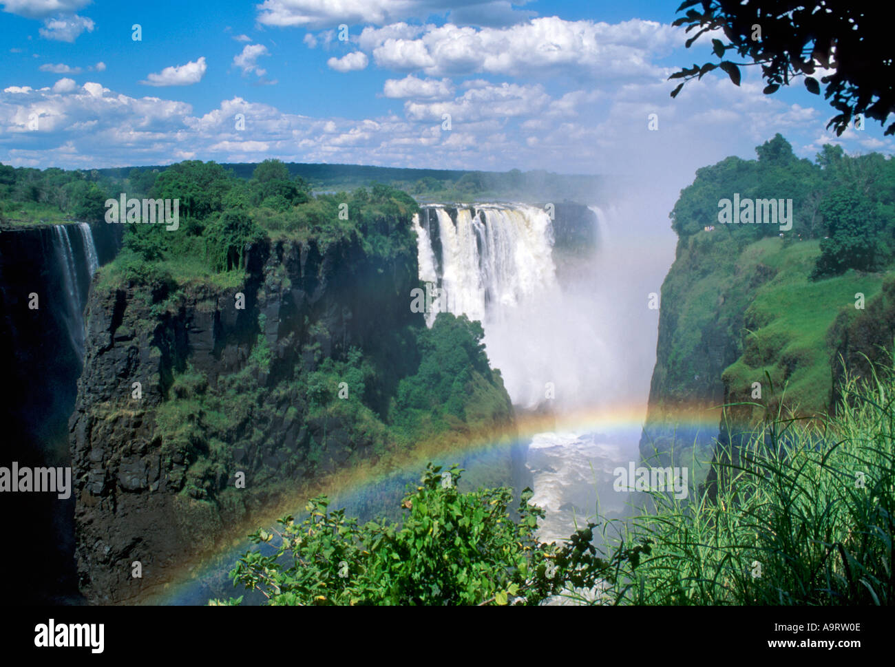 Rainbow over Victoria Falls. Zimbabwe Stock Photo