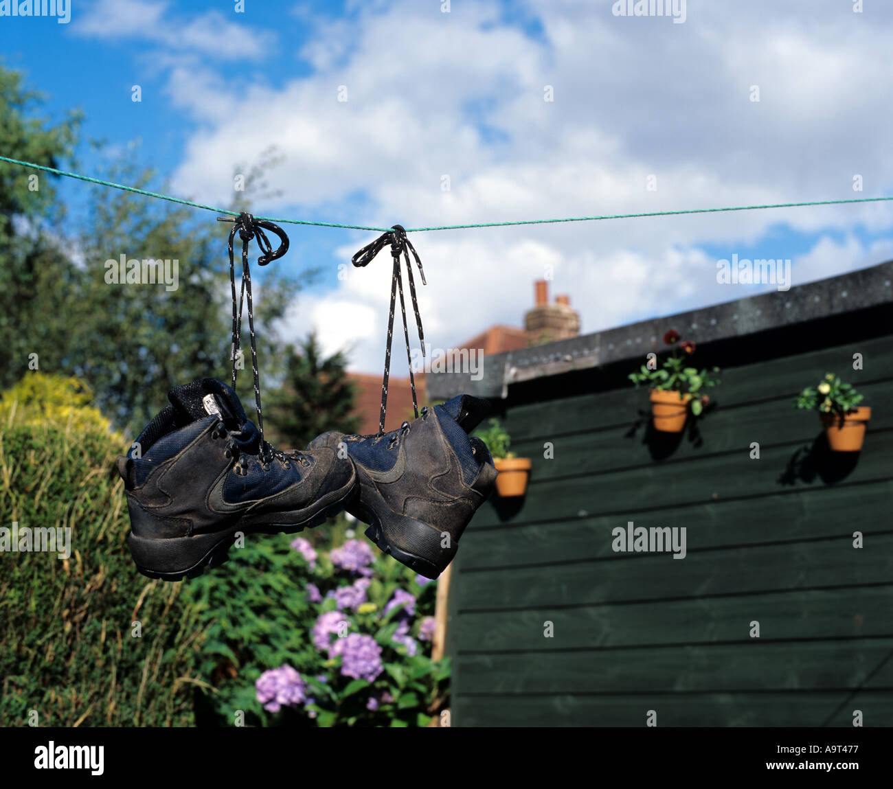 Hiking Boots drying out on washing line Stock Photo Alamy