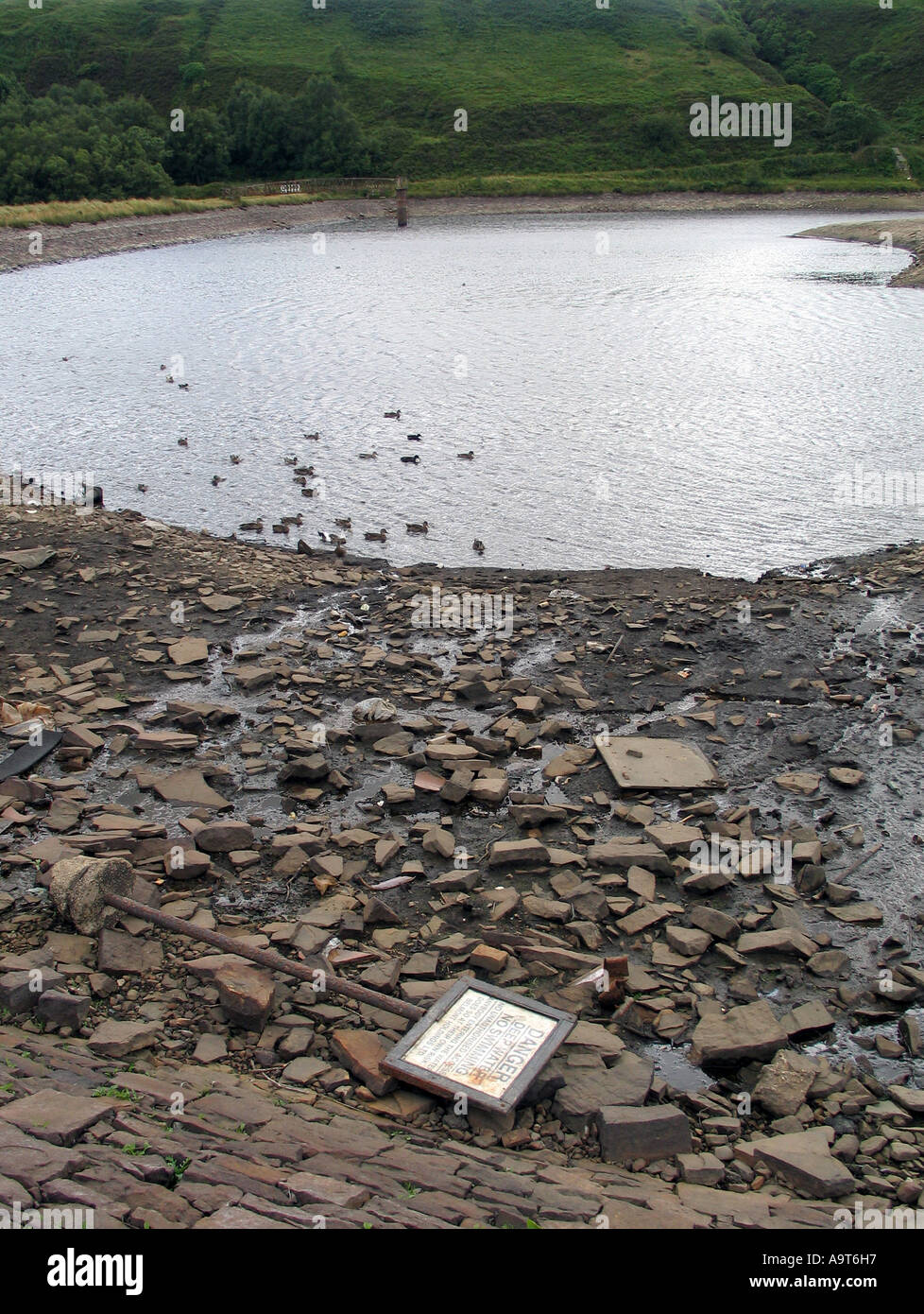Low water level at a reservoir in Belmont Village near Bolton, North West, England, UK. photo DON TONGE Stock Photo