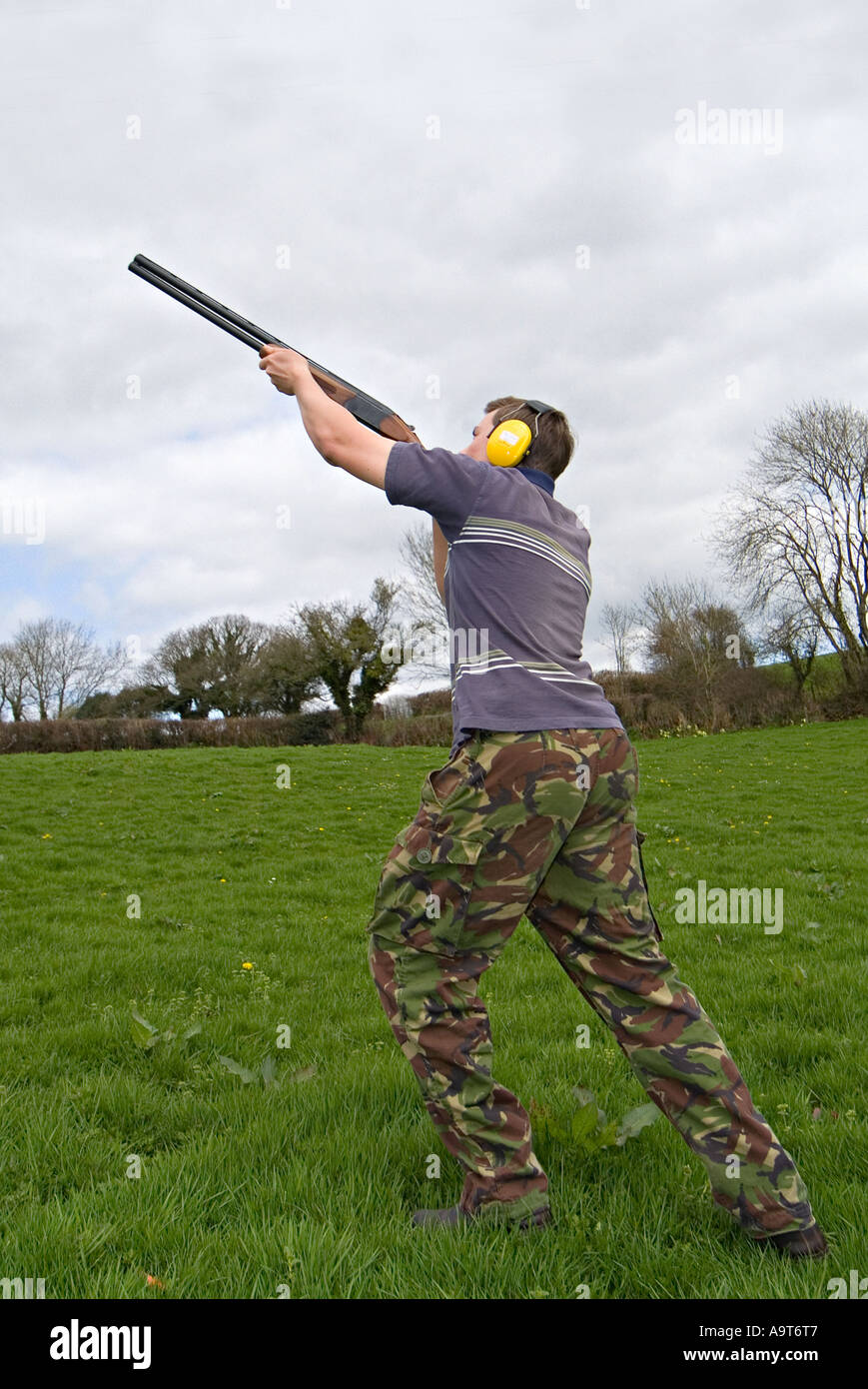 Enthusiastic amateur clay pigeon shooting in a Devon field. UK Stock