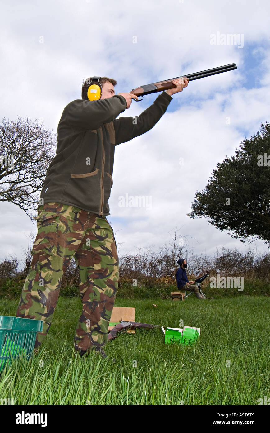 Enthusiastic amateurs clay pigeon shooting in a South Devon field. UK Stock Photo