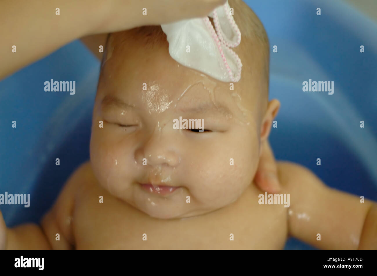 Mother bathing her 3 month old son Stock Photo Alamy