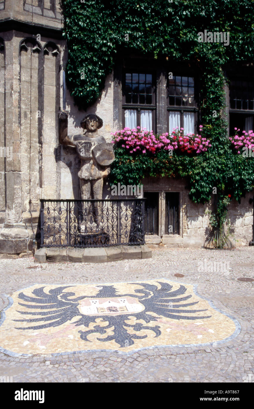 The Quedlinburg Roland and city crest in front of the town hall rathaus in Quedlinburg Germany Stock Photo