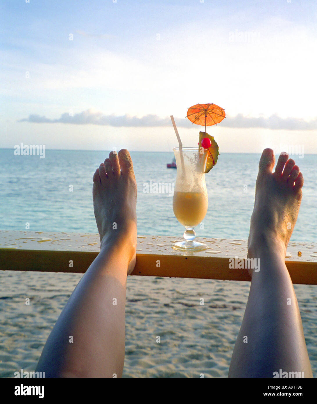Pair Of Feet On A Beach With Cocktail Stock Photo Alamy Pair Of Feet On A Beach With Cocktail Stock Photo Alamy