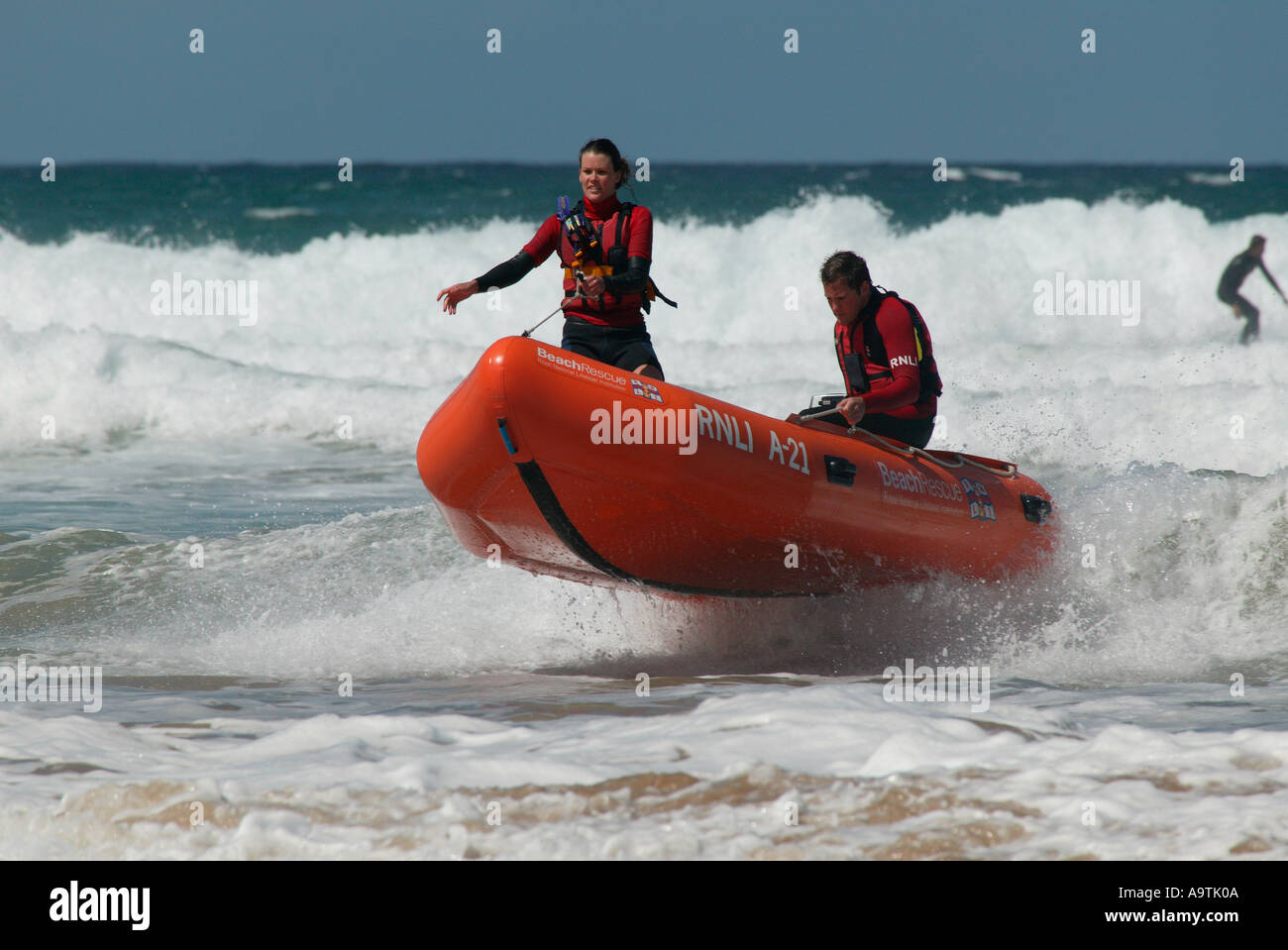 Life guards in rough seas in dinghy off Perranporth Beach, Cornwall, England, UK, Europe Stock Photo