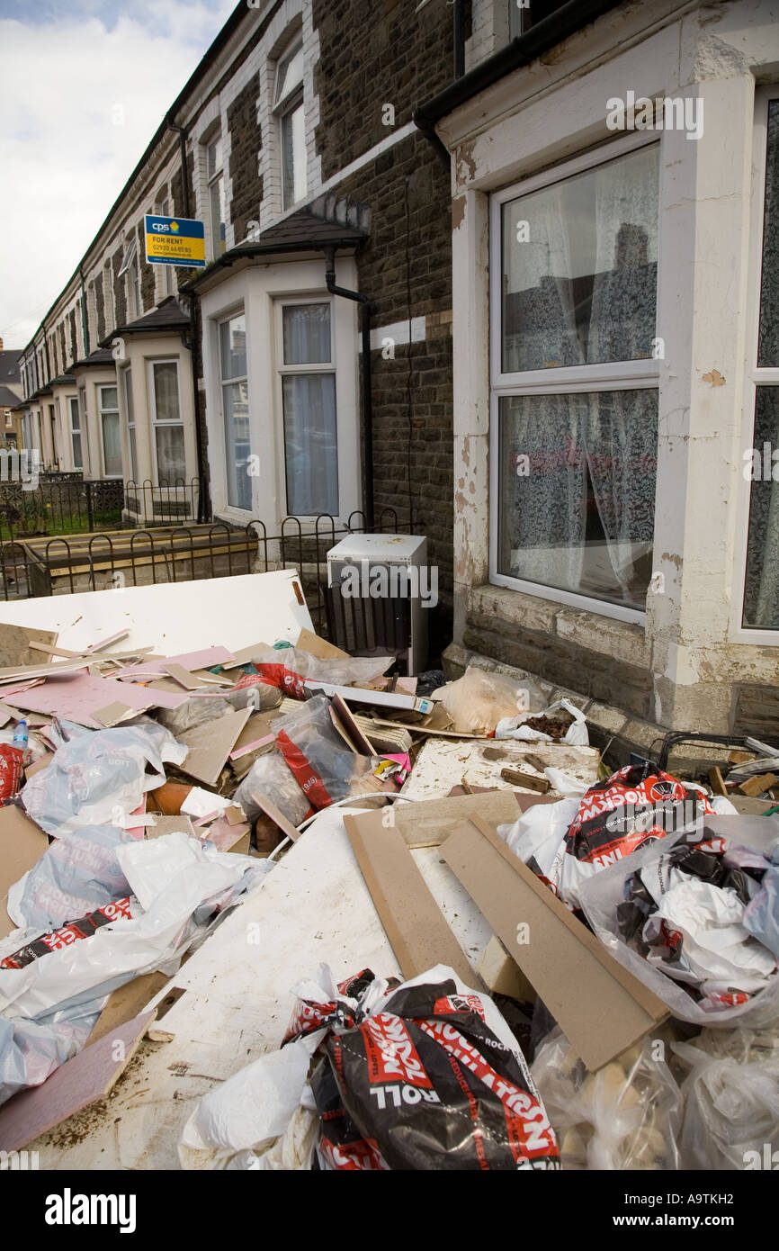 Rubbish dumped in garden of suburban terraced house in university