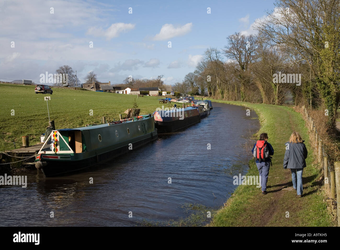 Woman walking canal towpath hi-res stock photography and images - Alamy