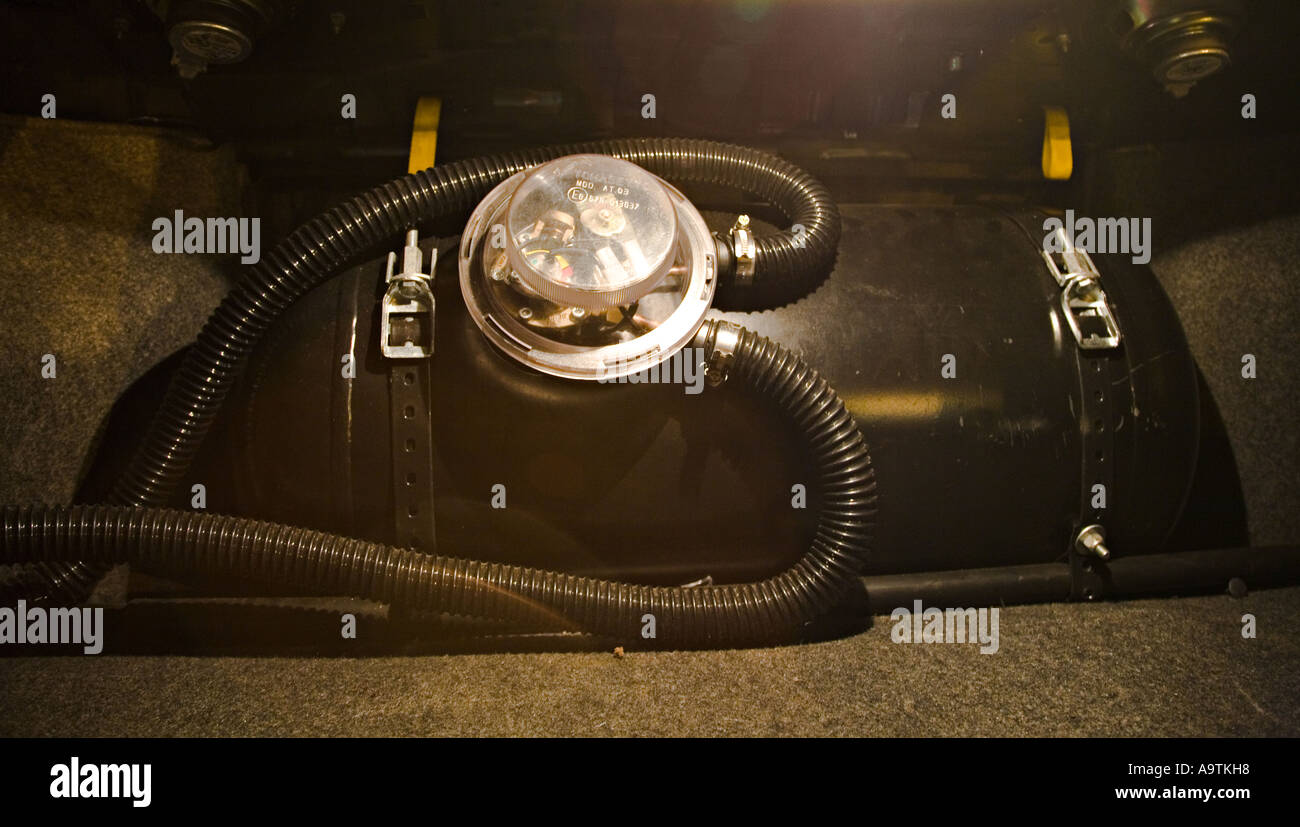 LPG cylinder fitted in boot of converted petrol engine car Wales UK Stock Photo