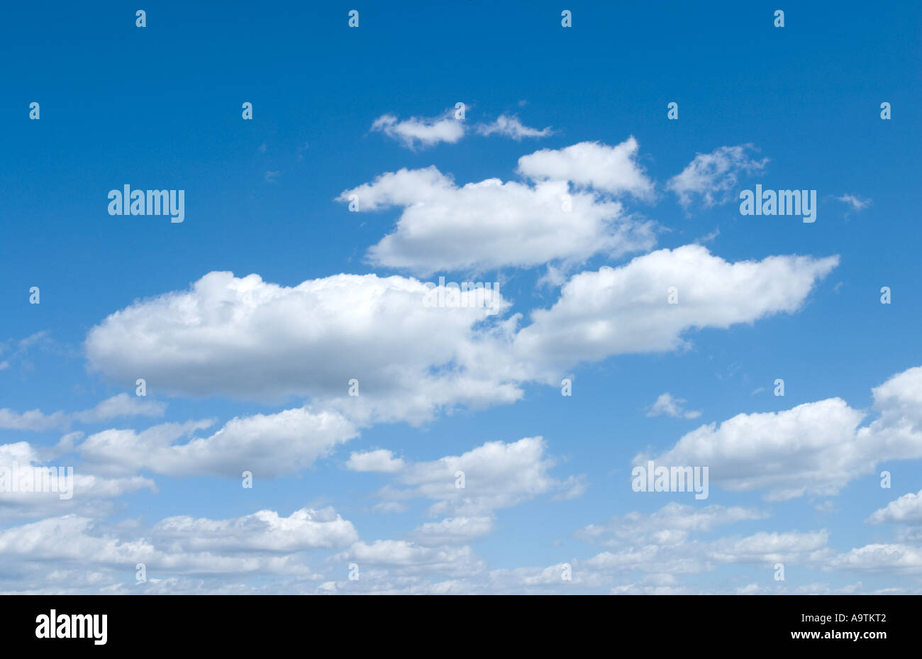 White Fluffy Clouds in Blue Sky Stock Photo - Alamy
