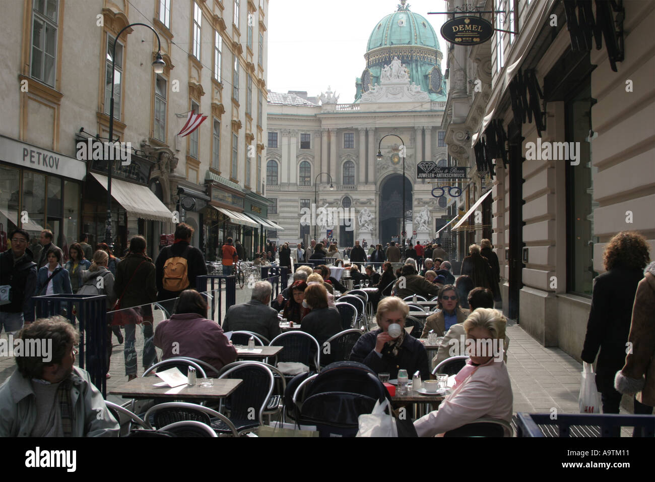 End of winter street scene with cafes in Vienna Stock Photo - Alamy