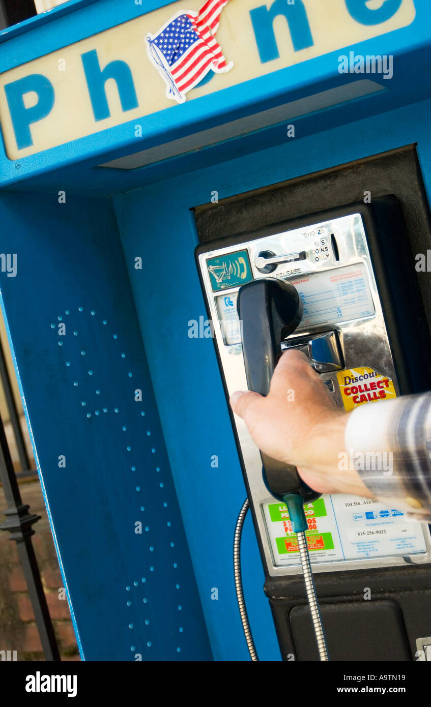 Lifting pay phone receiver off hires stock photography and images Alamy
