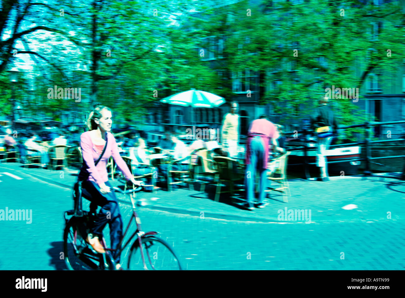 Amsterdam Jourdan woman on bicycle cross style Stock Photo