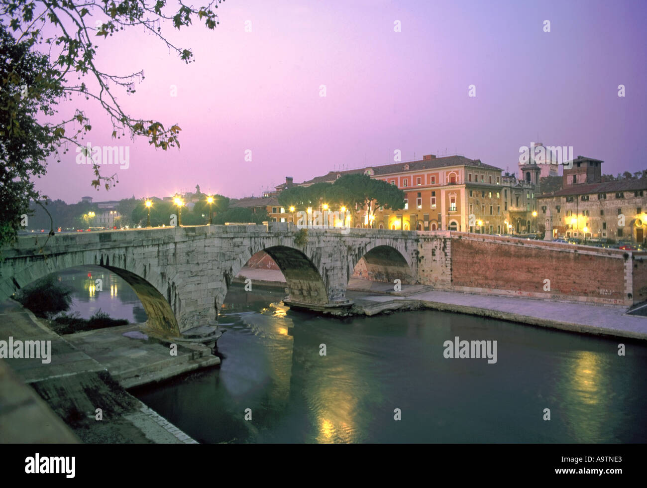 Italy Rome bridge over river Tiber St Peters Basilica at twilight Stock Photo