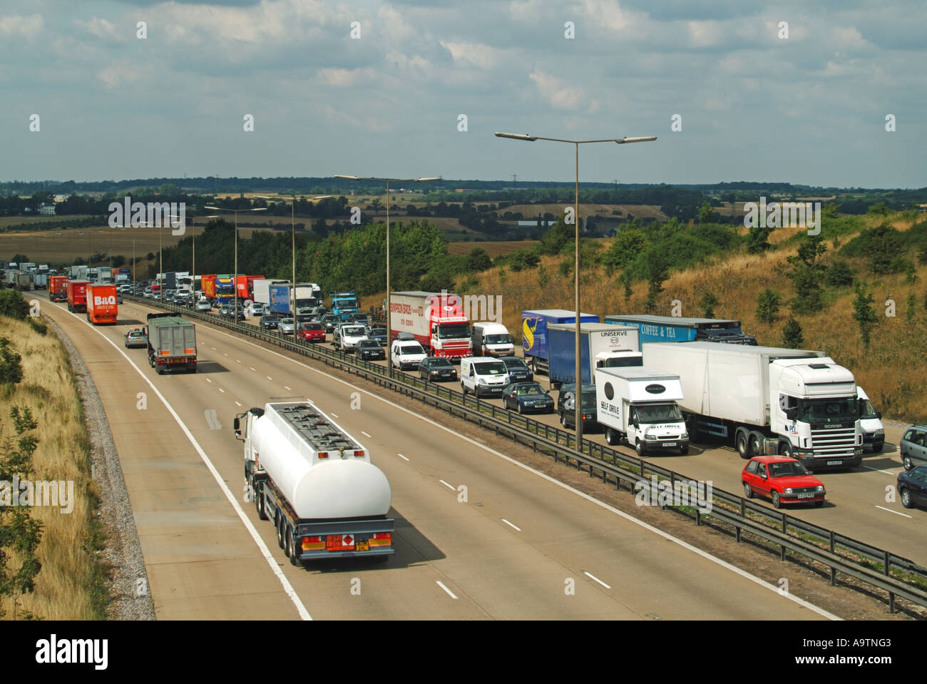 M25 Motorway queuing traffic clockwise and free flowing traffic anti