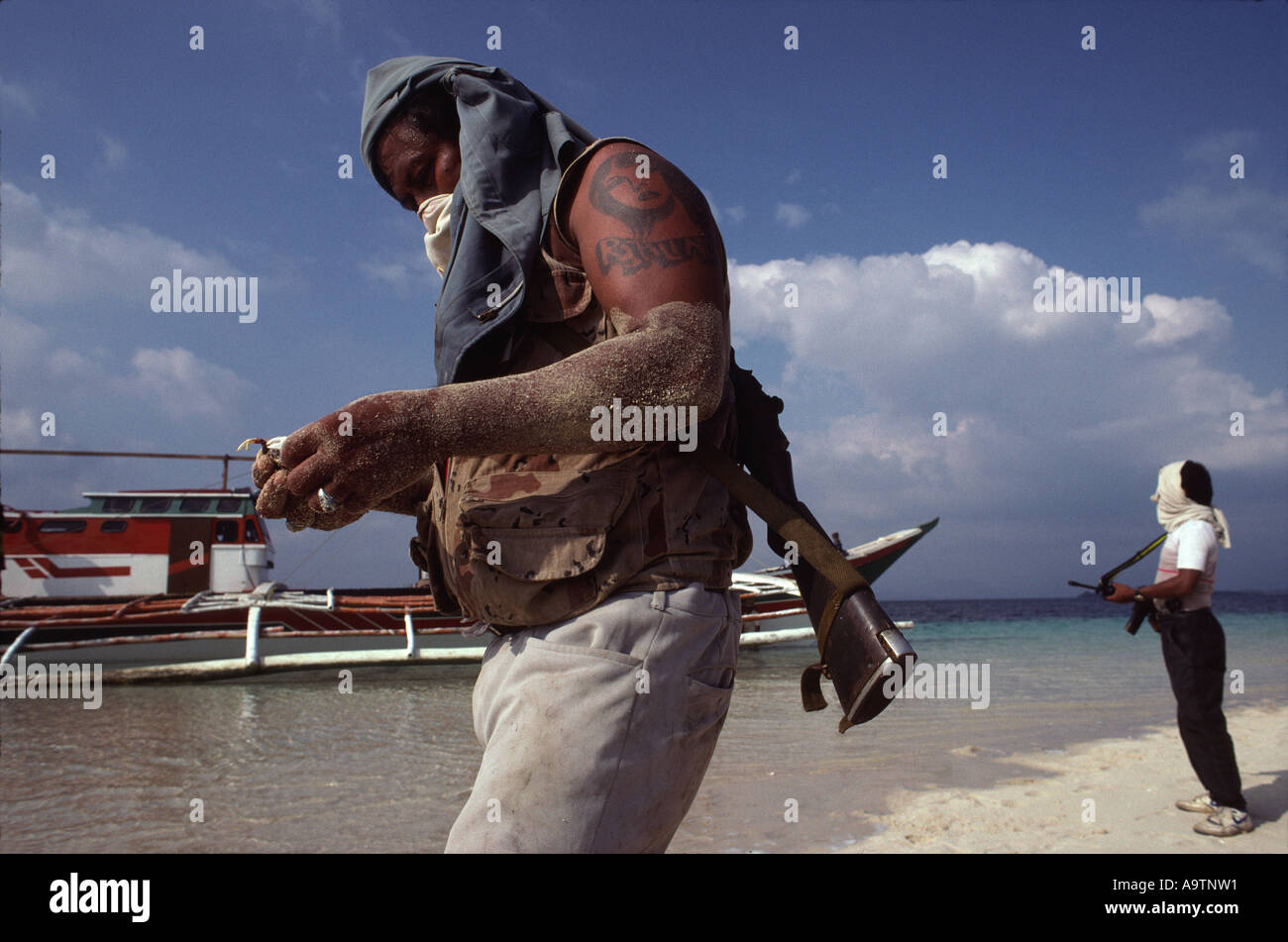 Pirate 'Big Boy' on the beach with crabs he has dug up for food Stock Photo