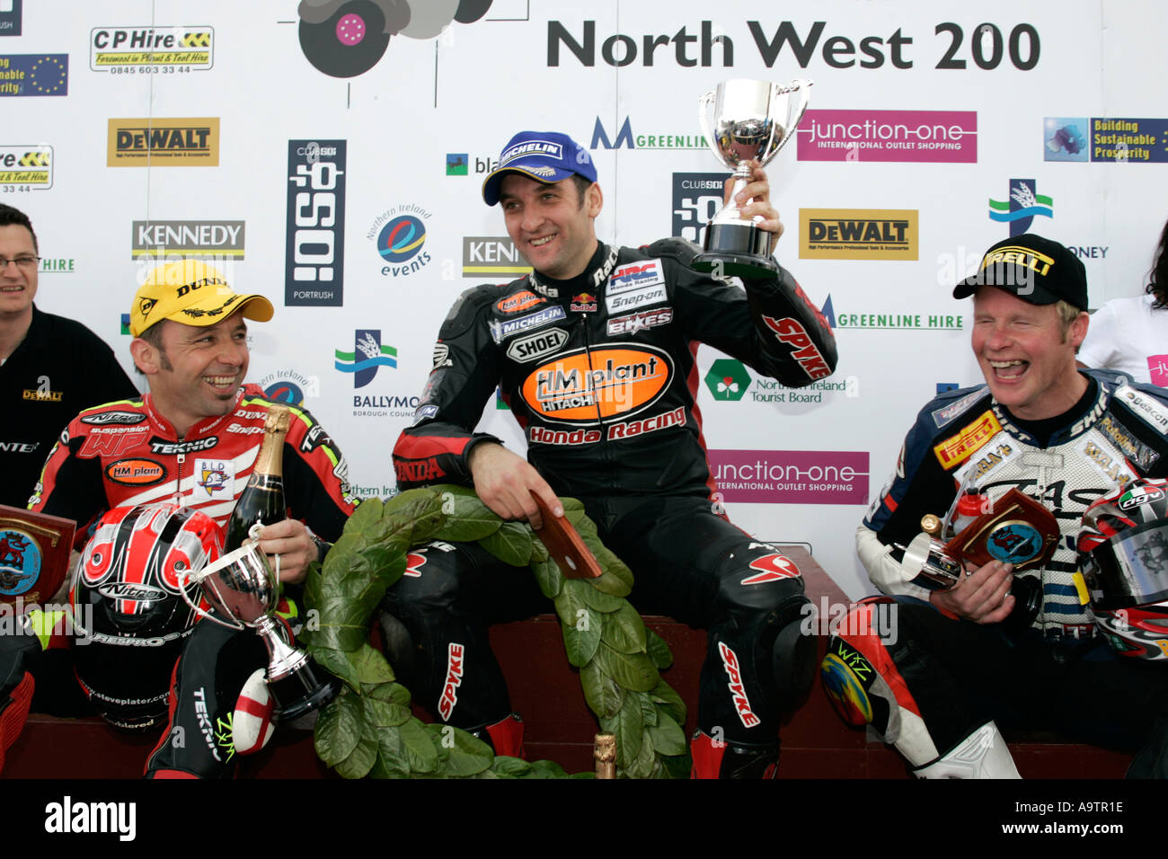 Steve Plater Michael Rutter and Adrian Archibald joke on the podium at the North West 200 Road Races NW200 Stock Photo