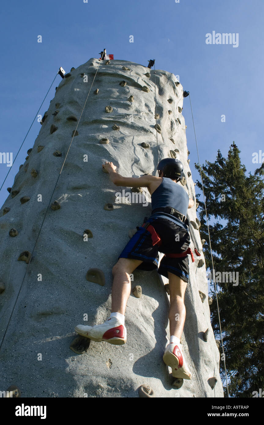Man scaling climbing wall hi-res stock photography and images - Alamy