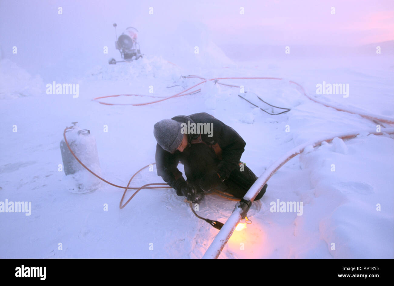 Using a blow torch to melt ice during construction of the Ice Hotel at Jukkasjavi in Sweden's
