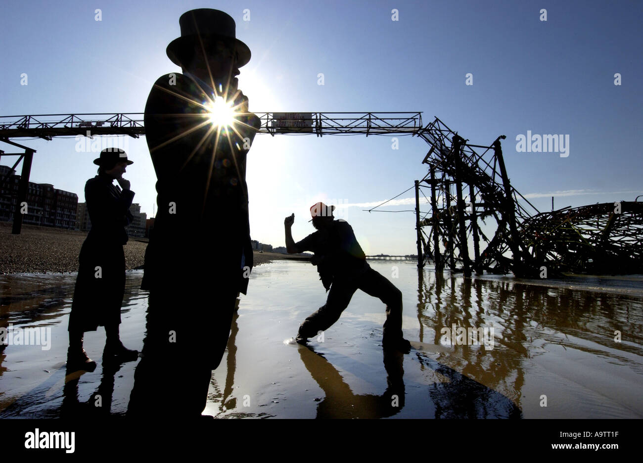 Stone skimming competition on Brighton Beach. A contender lobs a stone