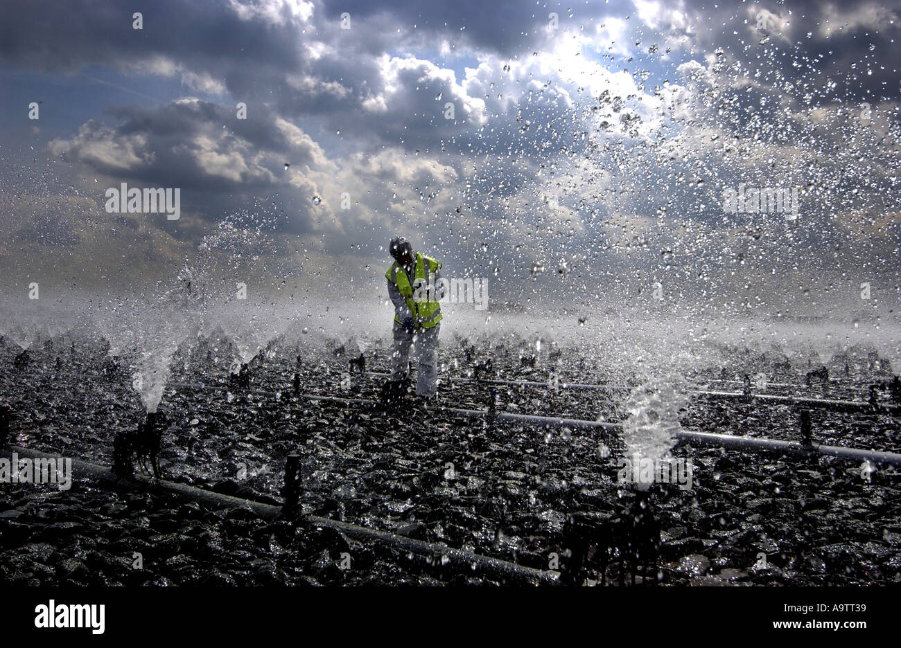 A sewage worker carries out essential cleaning and maintainance work at Severn Trent Water's Wanlip sewage works in Leicester Stock Photo