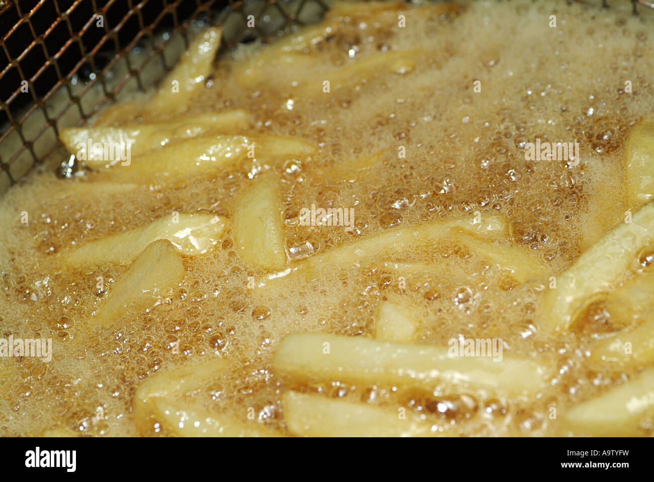 Chips in a Deep Fat Fryer Cooking Stock Photo Alamy