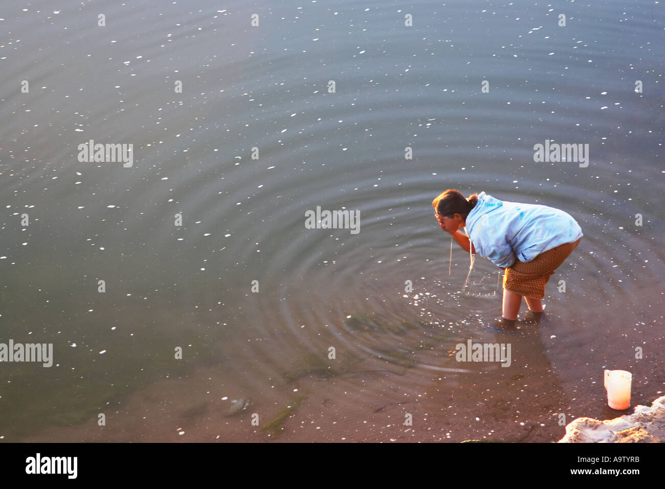 Woman Washing Face In River Stock Photo - Alamy