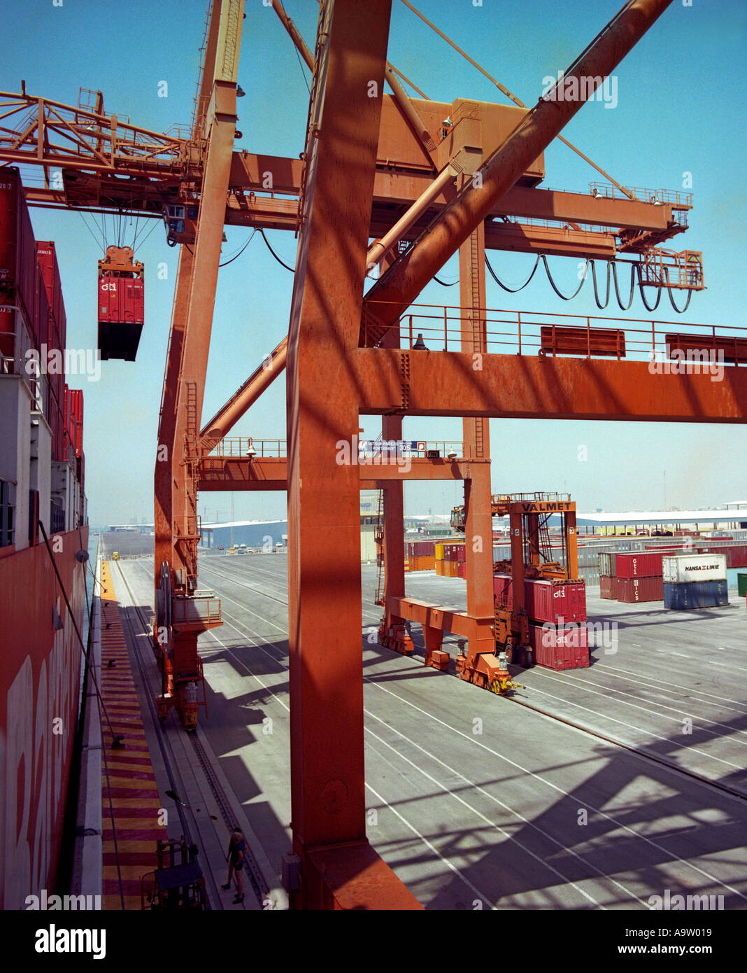Shipping containers being unloaded at the docks Stock Photo - Alamy