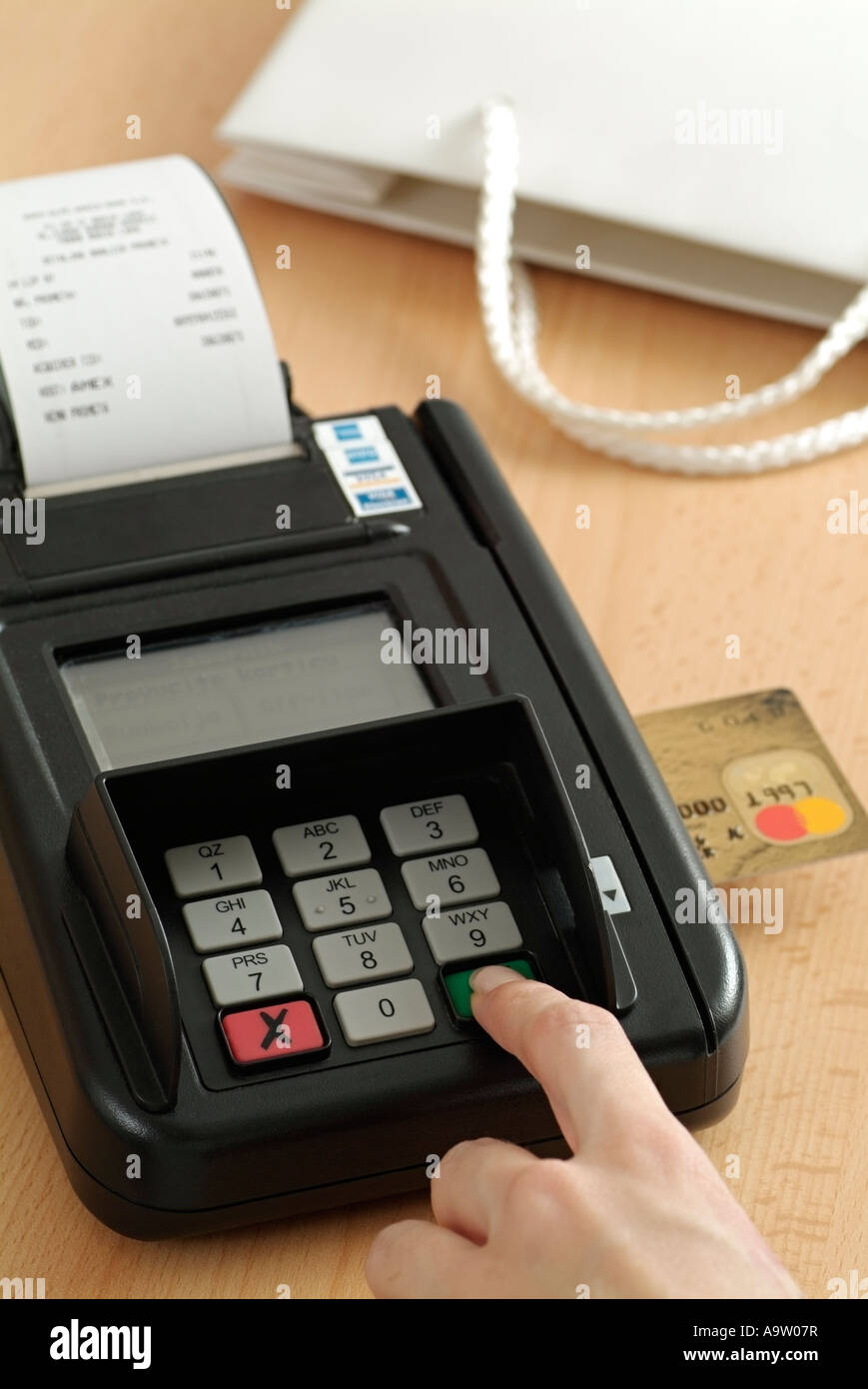 Credit Card Woman Paying with a Card in a Store During a Shopping Trip Stock Photo