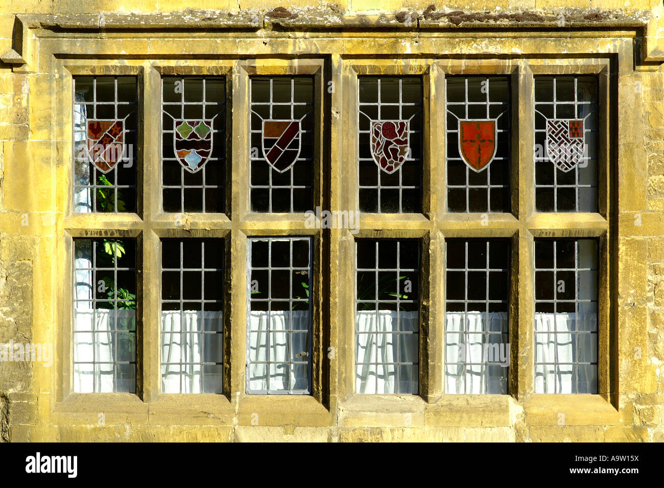 traditional window in old English sandstone house in Cotswold Stock