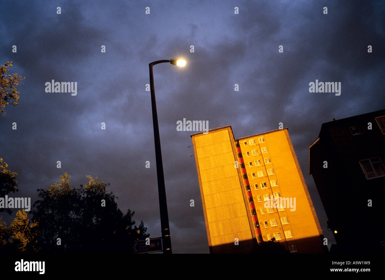A housing block in Hackney, East London, glows in golden autumn evening light. Stock Photo