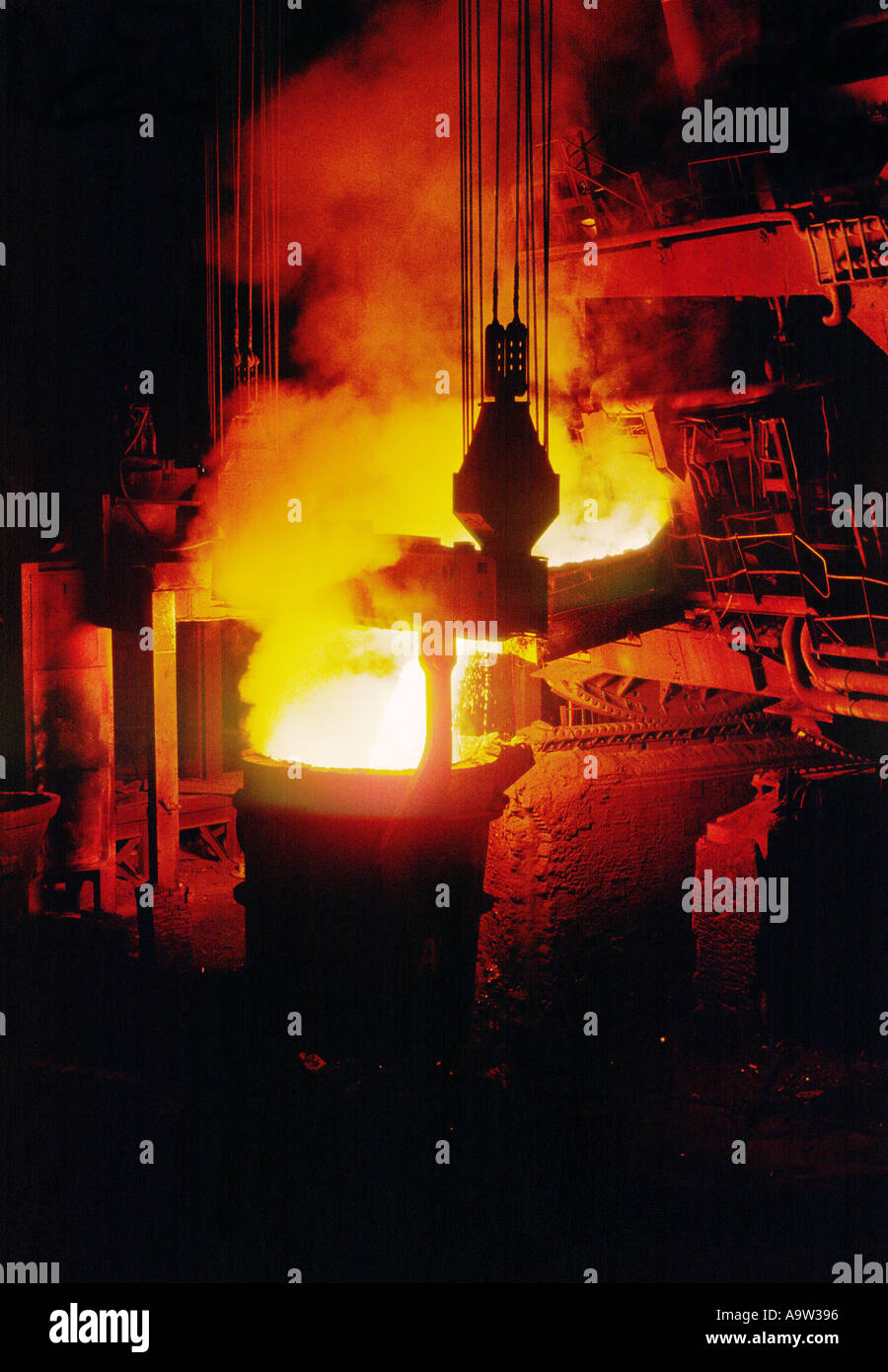Steel furnace pouring charging molten steel into AOD vessel during stainless steel refining at British Steel Stainless Sheffield Stock Photo