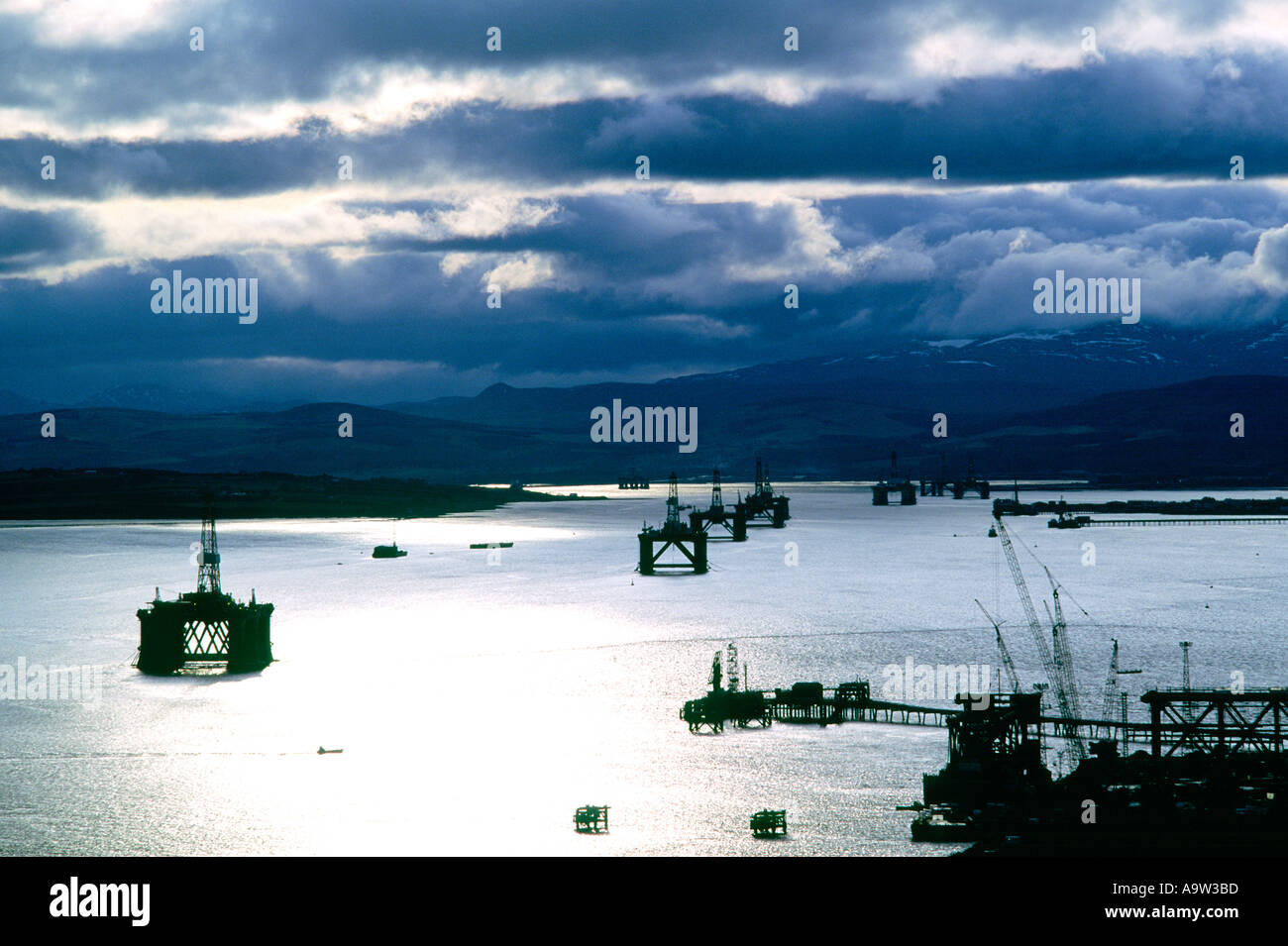Drilling rigs platforms in safe haven of Cromarty Firth, Highland Region, Scotland at height of the North sea oil industry boom Stock Photo