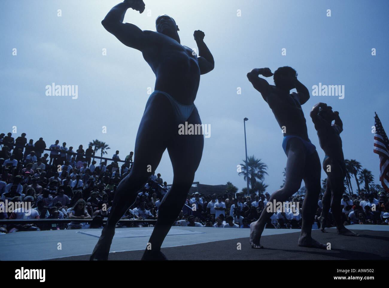 Body builders flexing muscles muscle beach Venice beach California U S