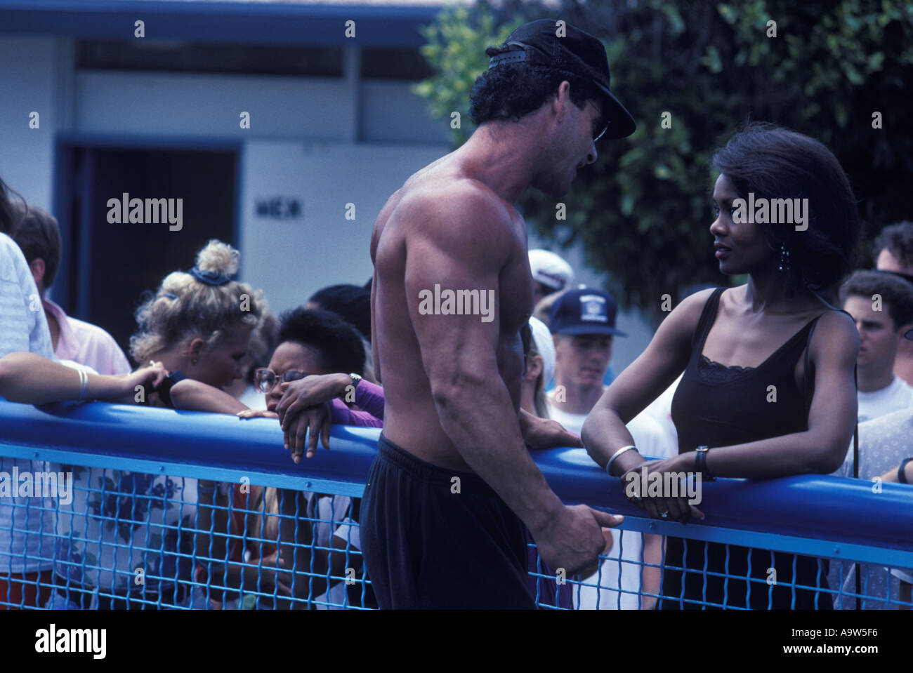 Man and woman flirt muscle beach California L A Stock Photo