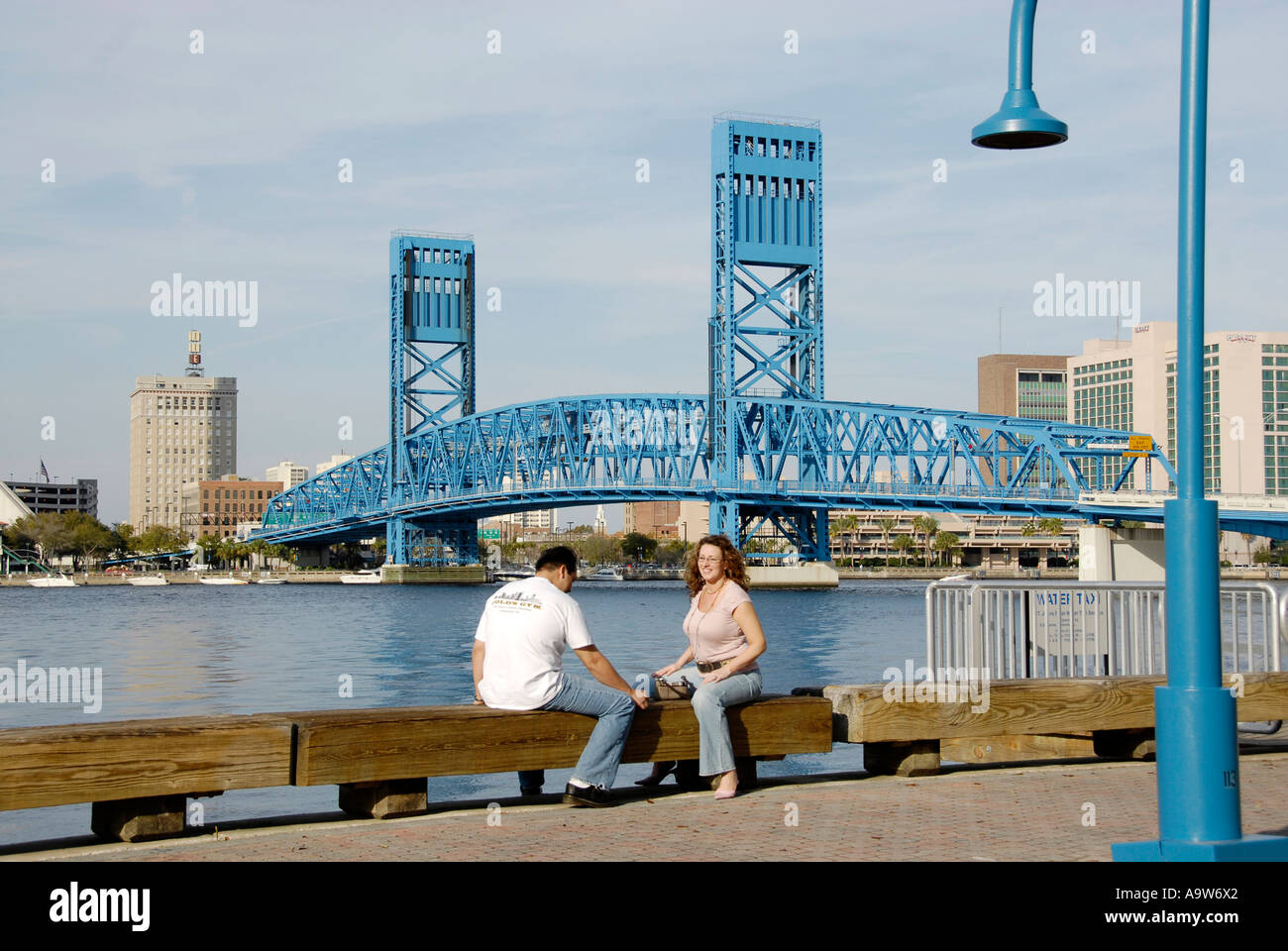 Husband and wife couple relax by the Bridges in the city of