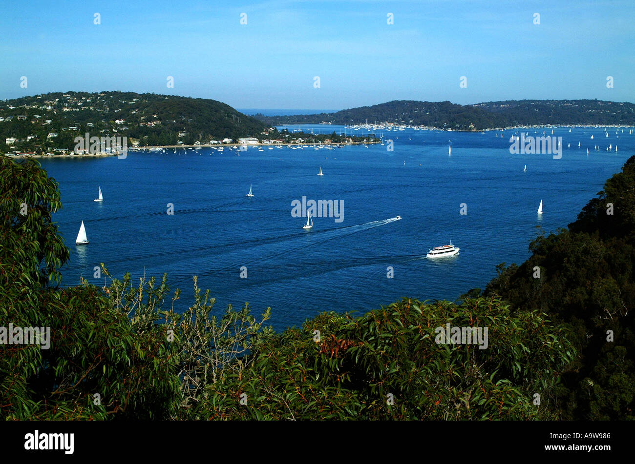 SCENIC over looking water inlet with boats and hills Stock Photo