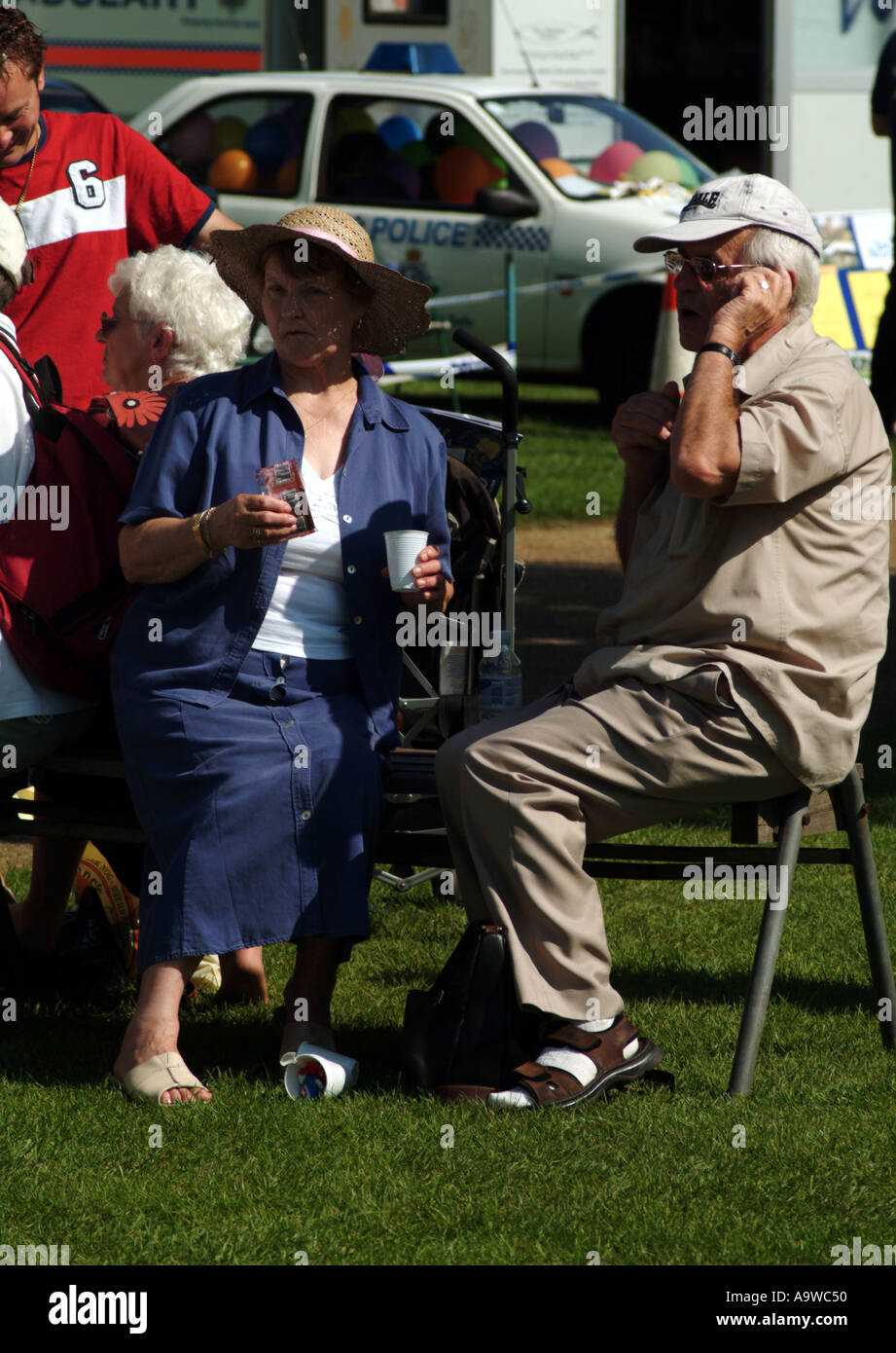 Husband and wife pensioners sitting together Stock Photo