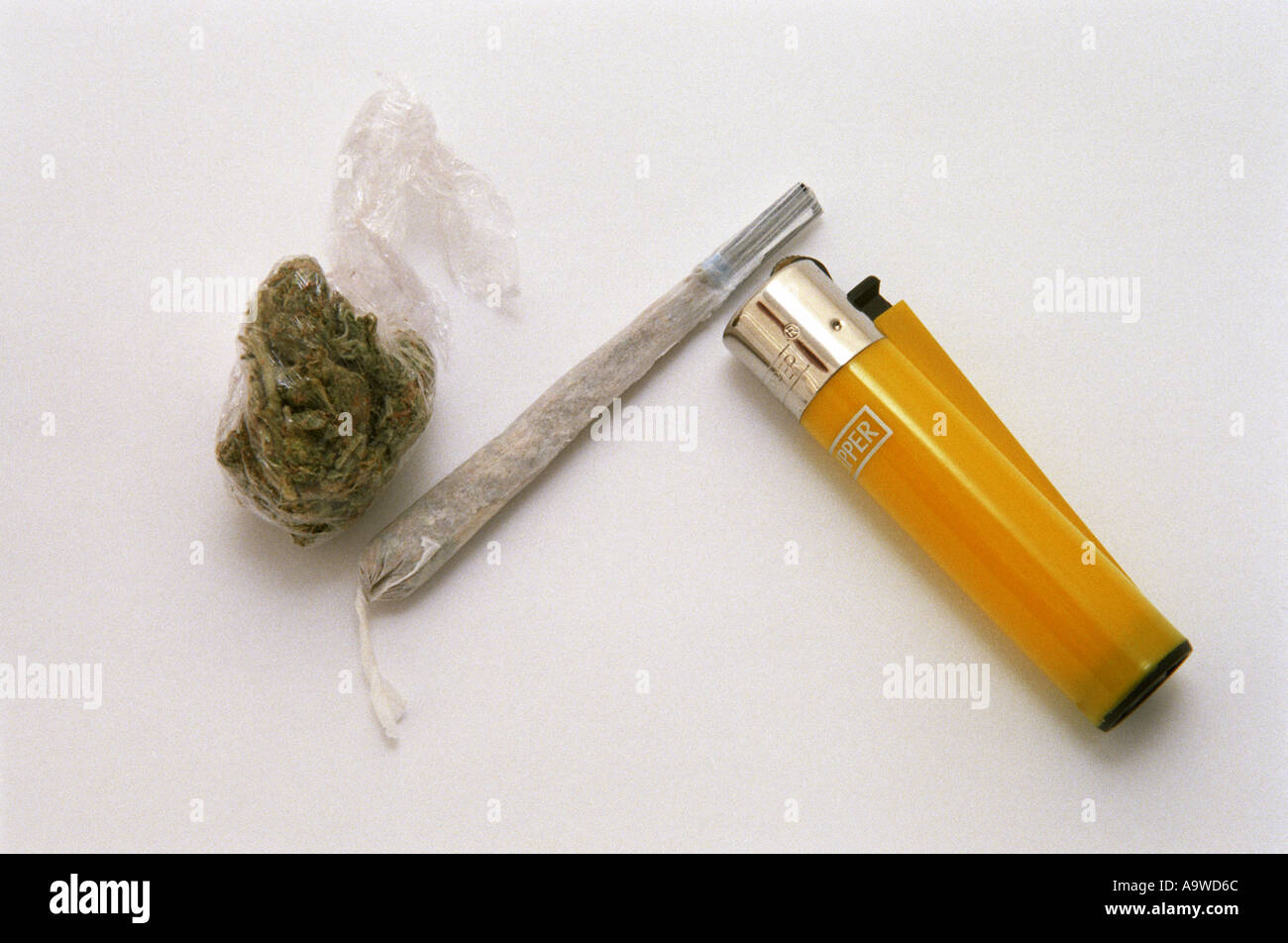 Yellow lighter spliff and Weed Stock Photo