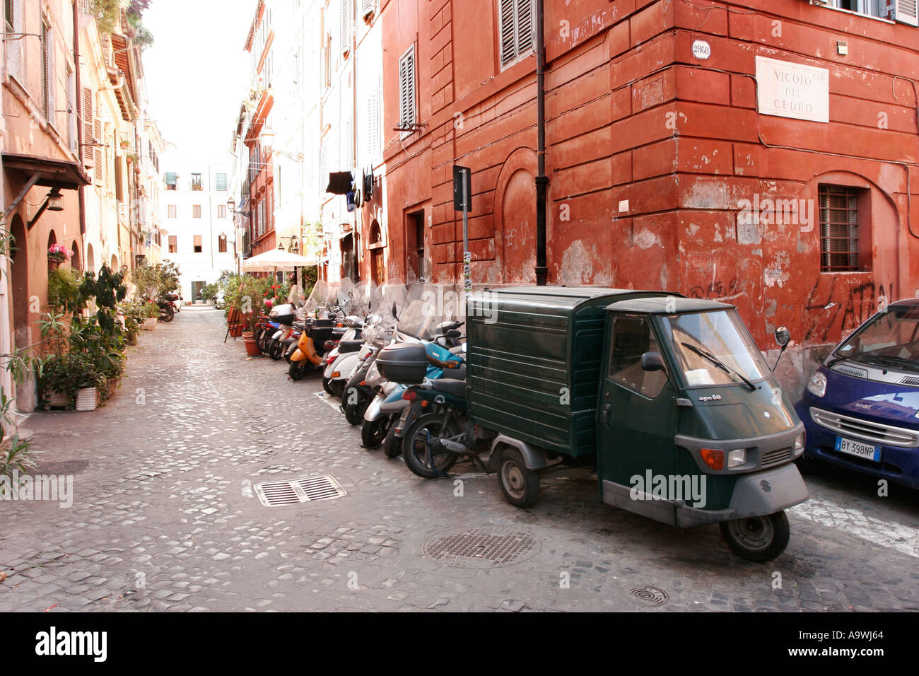 Three wheel mini van in Rome Italy Stock Photo