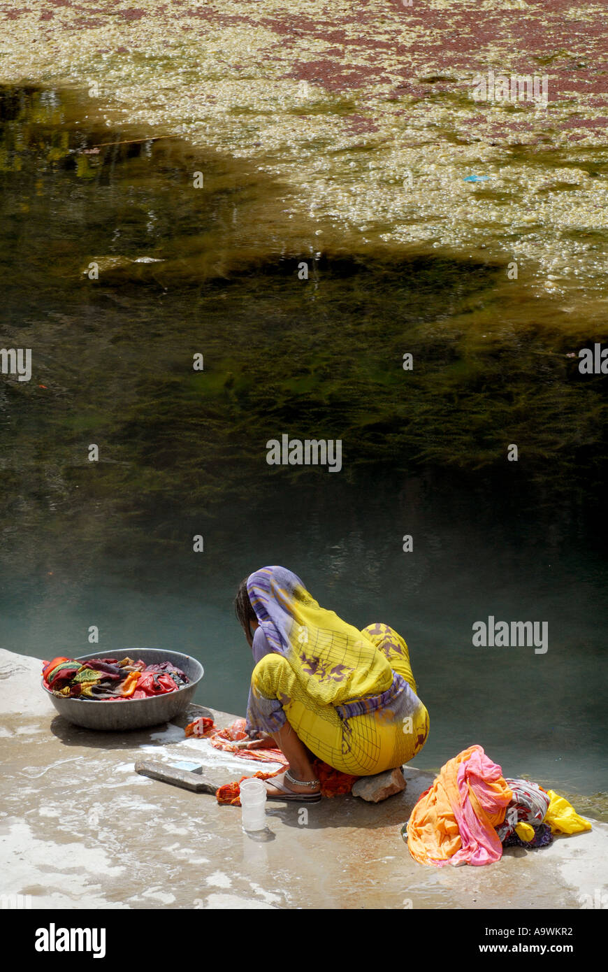 Indian Washing Indian girl washing clothes hi-res stock photography and images - Alamy