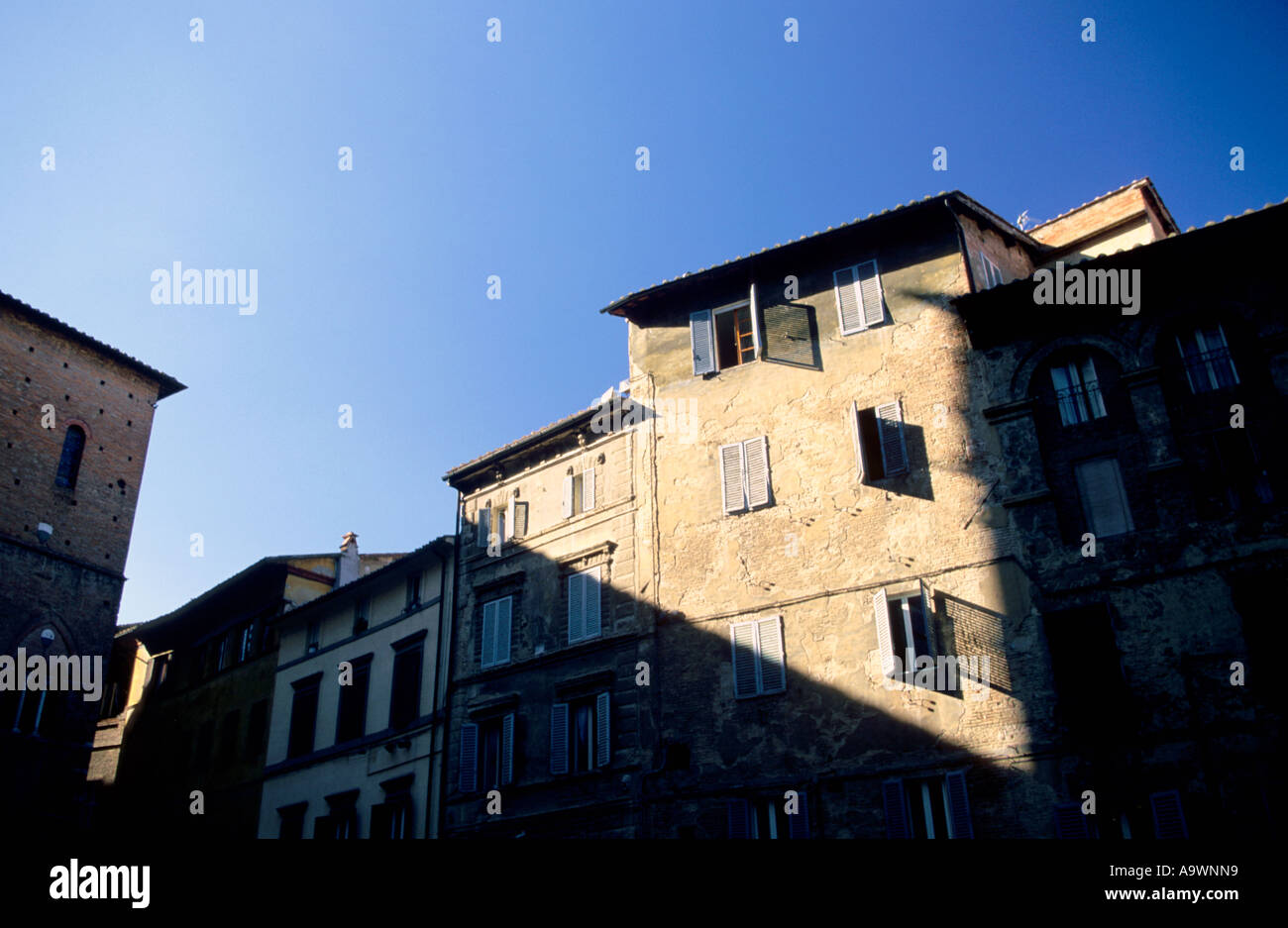 Tuscany, Siena, buildings with shuttered windows, low angle view Stock Photo