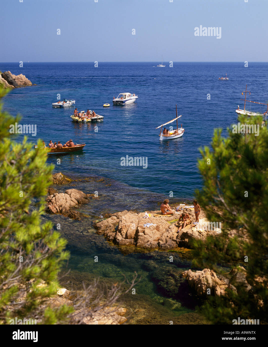 Boats in a sheltered cove at Agua Gelida on the Costa Brava near Palafrugell Catalonia Spain Stock Photo