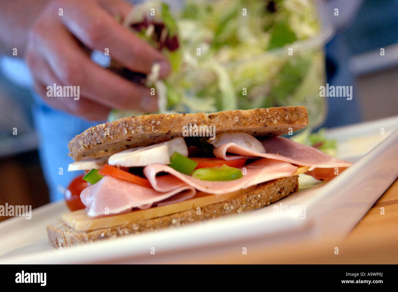 Making a Boterham a Dutch lunchtime sandwich Ham cheese green pepper
