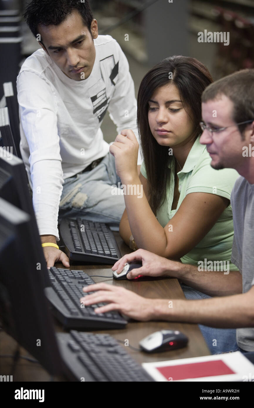 Three university students using computer Stock Photo - Alamy
