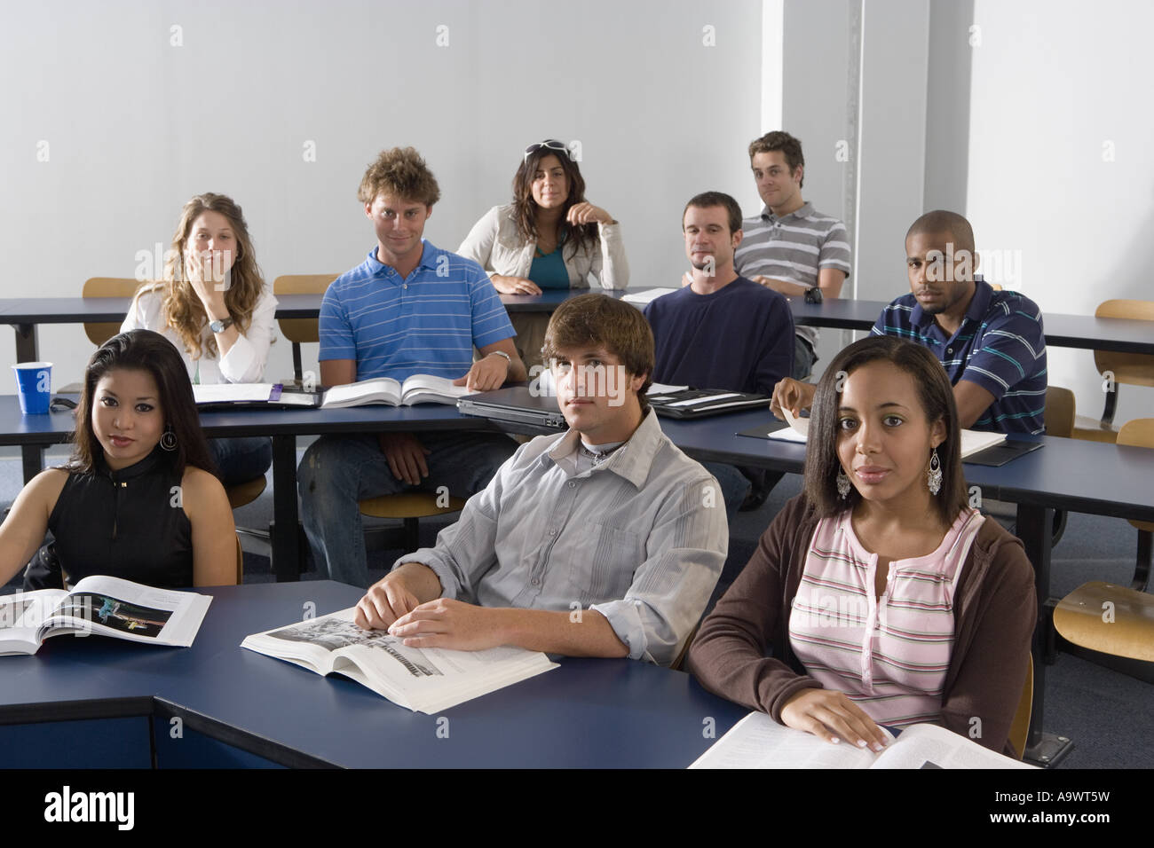 Portrait of students sitting in the classroom Stock Photo - Alamy