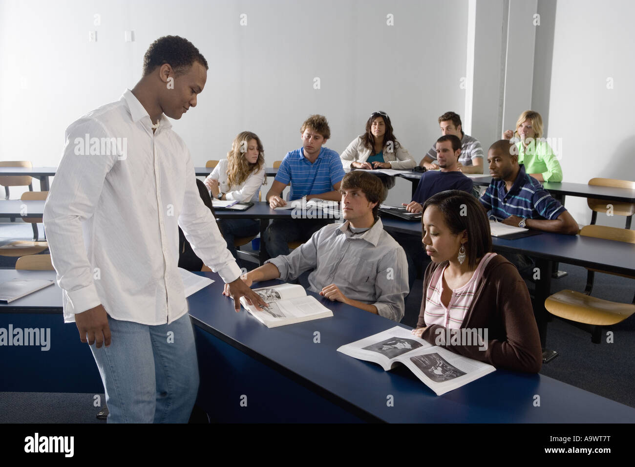 Teacher teaching students in the classroom Stock Photo