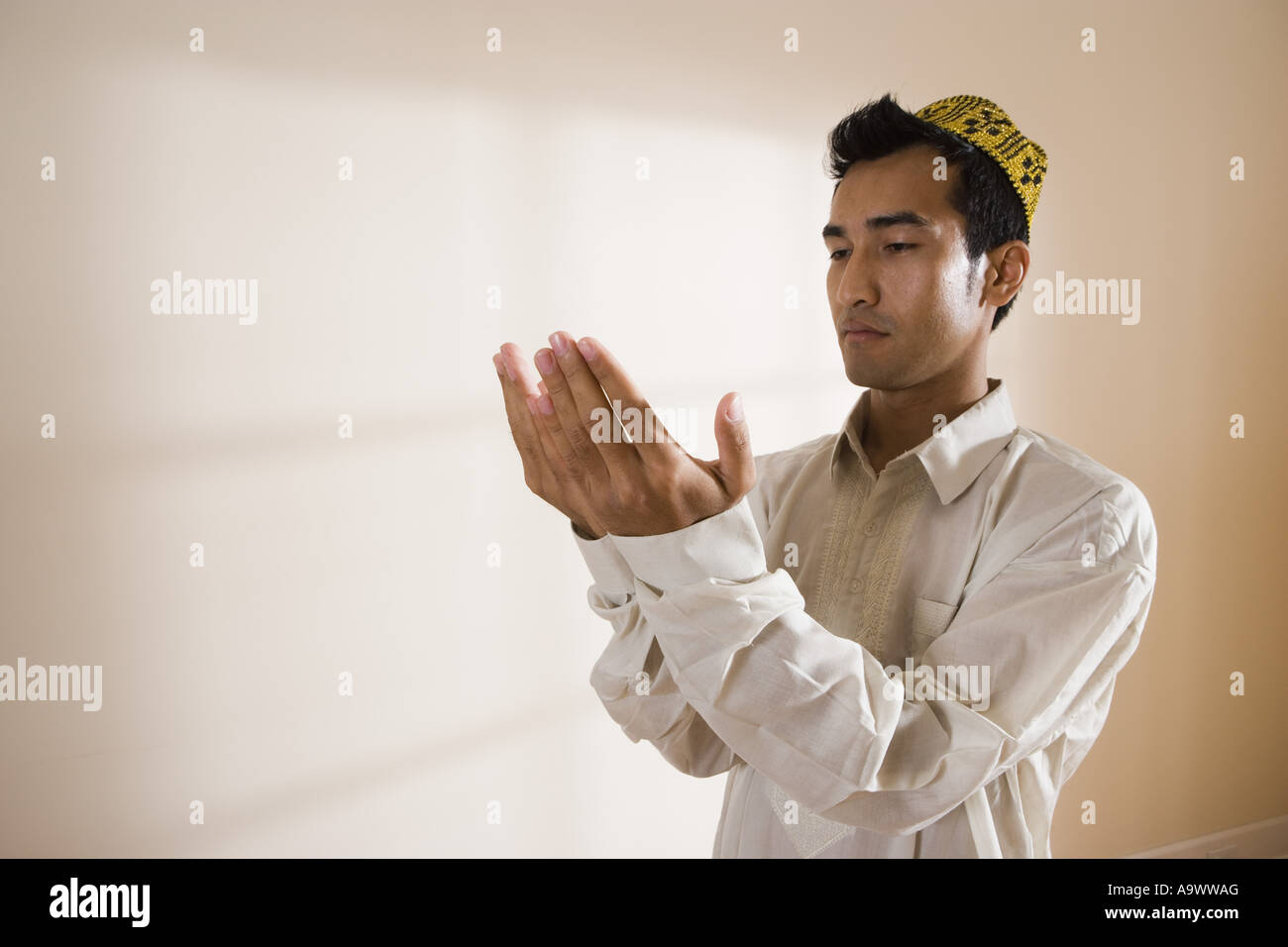A Muslim man praying Stock Photo - Alamy