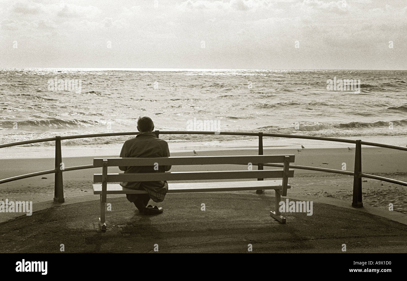Pensive man sitting on beach hi-res stock photography and images - Alamy