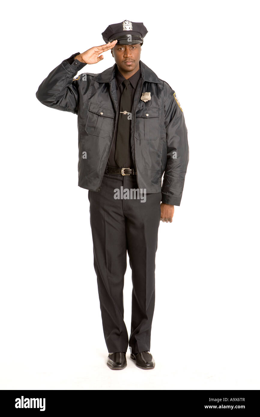 Black American policeman saluting at attention towards the camera in uniform Stock Photo