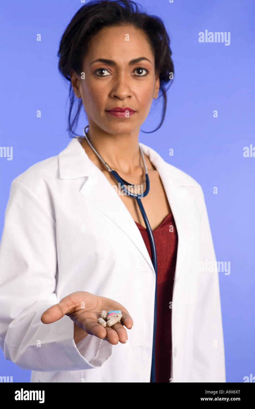 Female African American Doctor In A White Coat Offering A Palm Full Of 